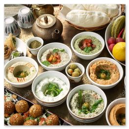 Colorful mixed meze platter with dips and salads