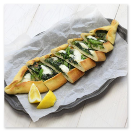 Mixed topping pide served on a wooden board
