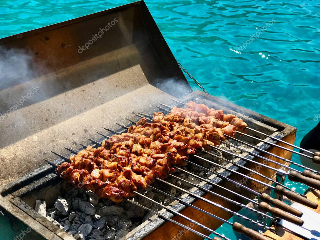 Charcoal-grilled kebabs on skewers