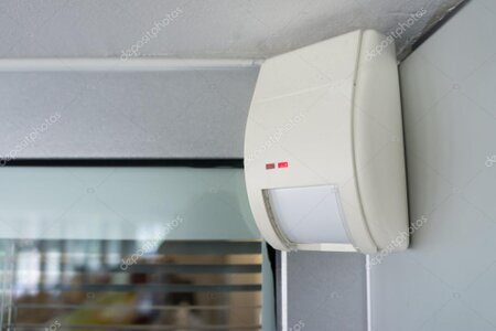 Wall-mounted motion sensor for an alarm system